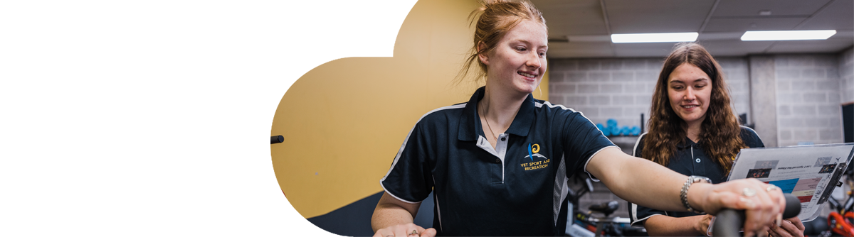 Two female students doing sports science