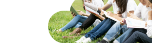 Students sitting on grass studying