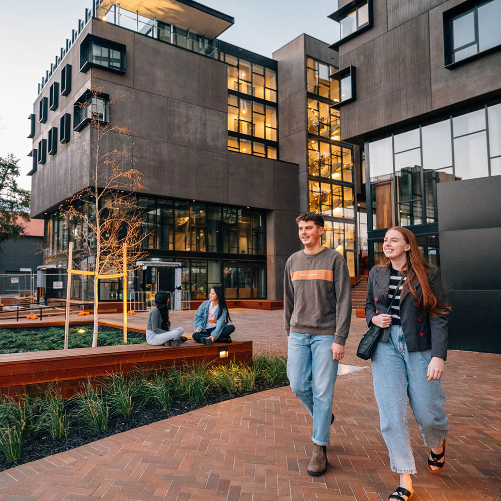 students walking out side accommodation building