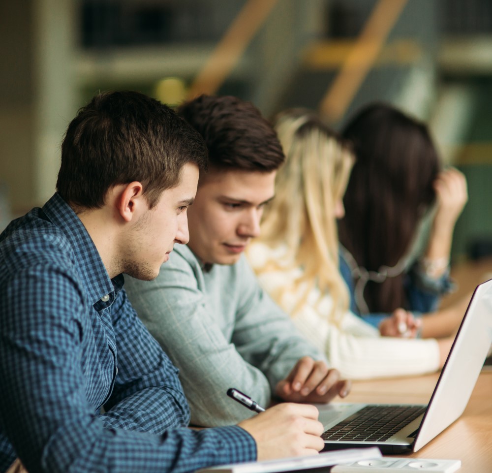 Two male students at school working on a computer