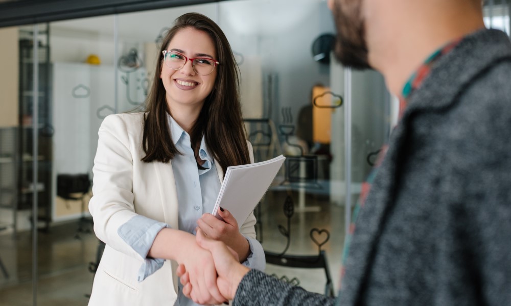 Female professional shaking hands