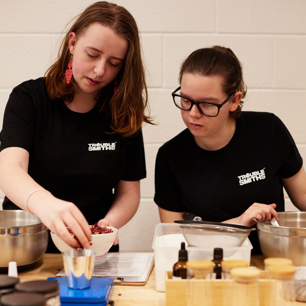 Two young women cooking