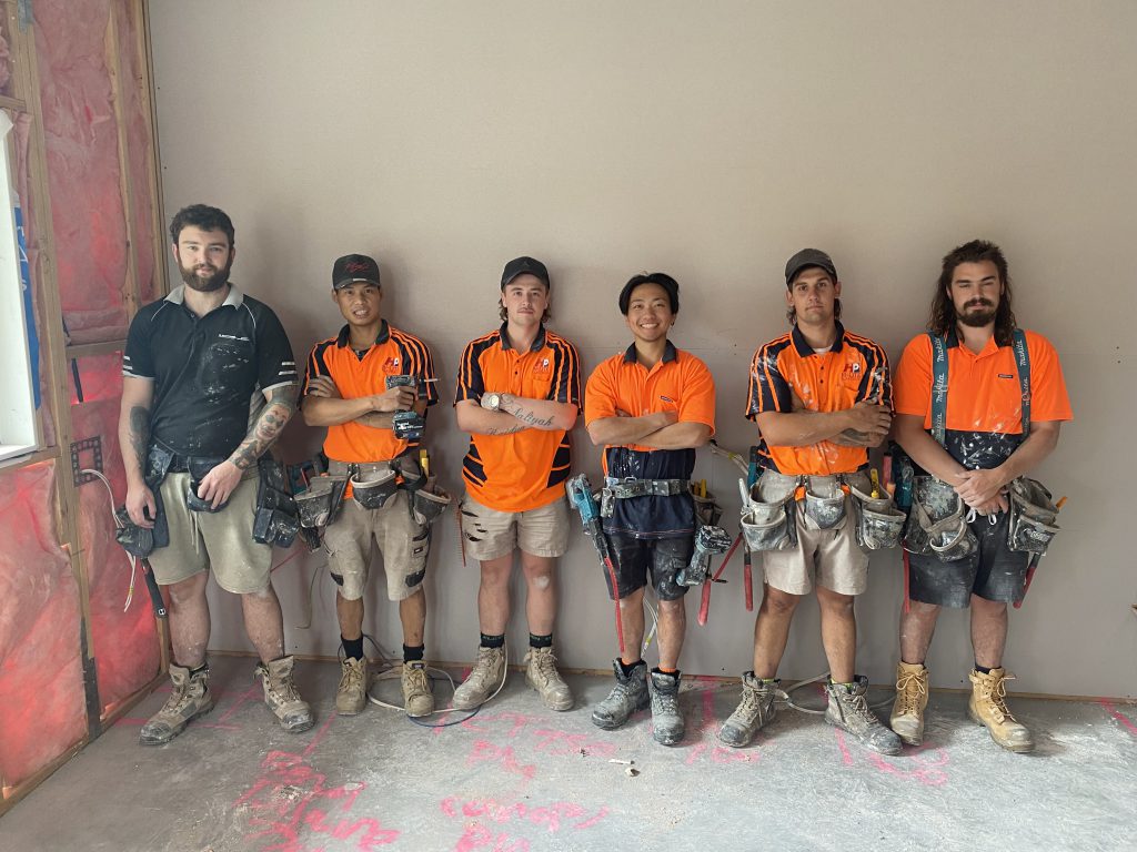 Young male workers smiling at camera