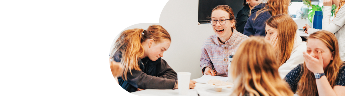 Young female students talking and smiling