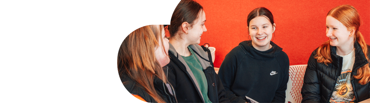 Young female students talking and smiling