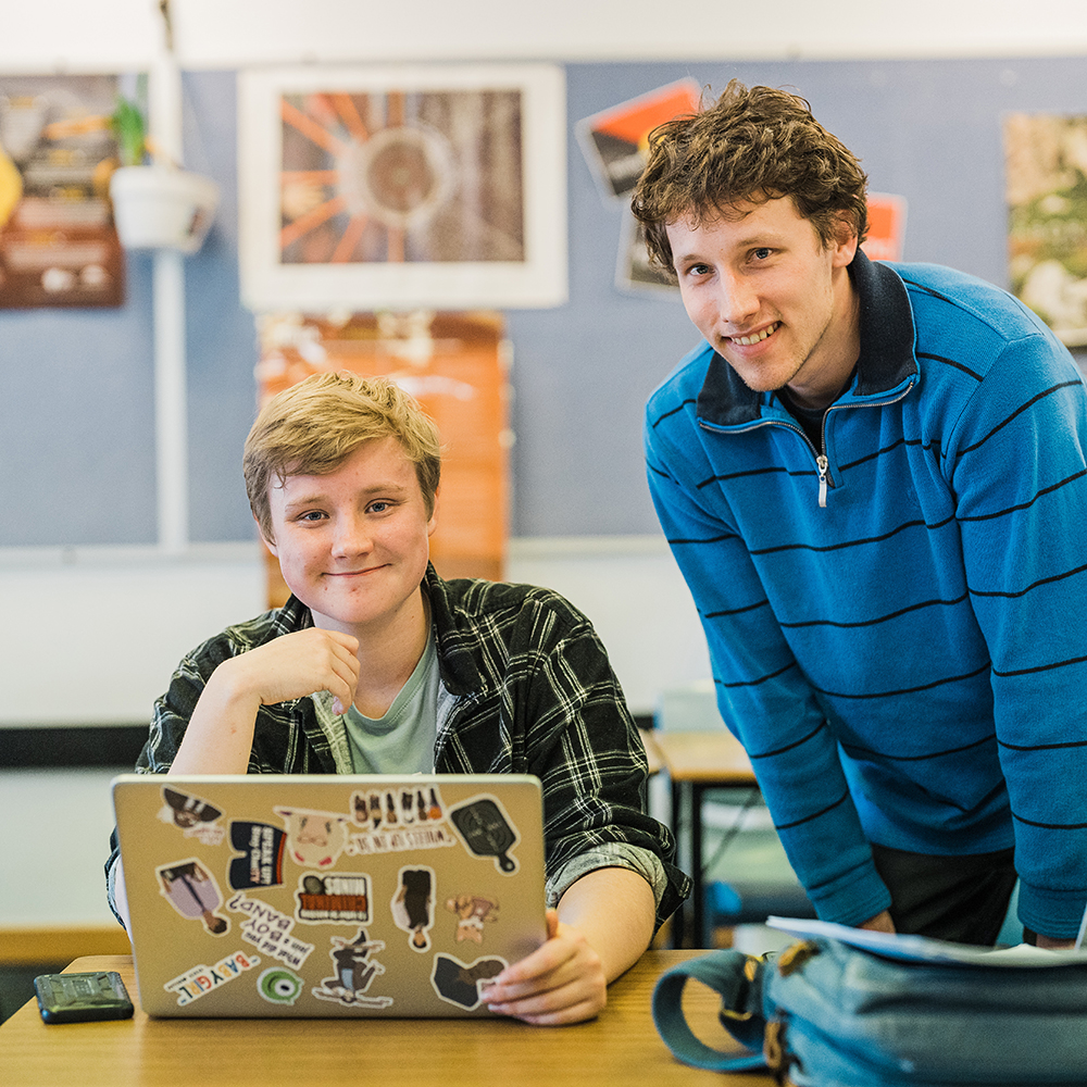 Two students looking at a computer