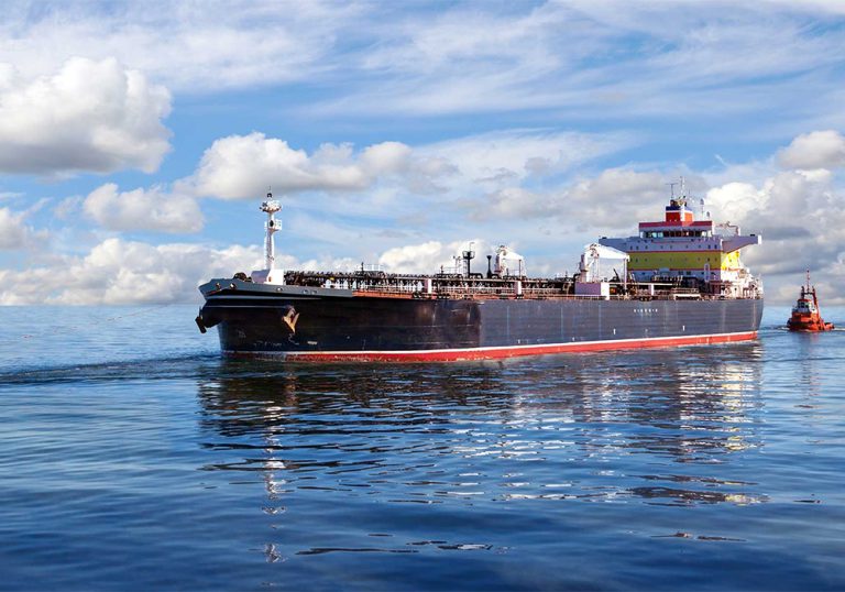 Large transporting ship on still blue water