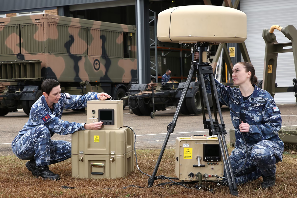 Two female air force personnel inspecting equipment