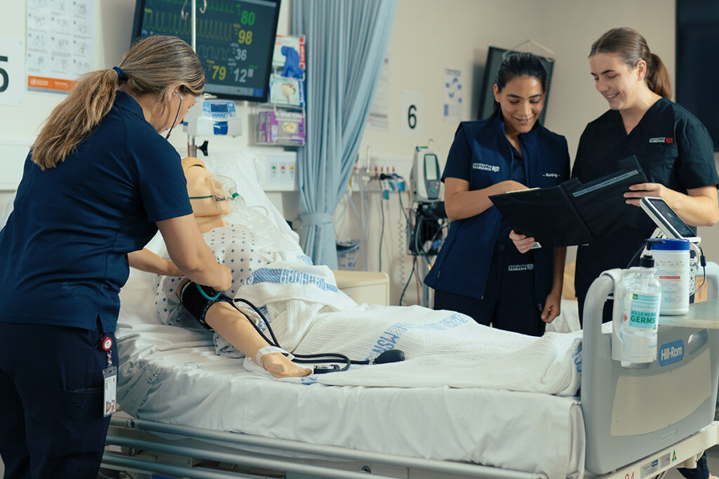 Female medical students conduting a simulation exercise